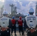USS Bulkeley Sailors stand at parade rest on the foc’sle