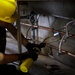 Plumbers with the South Dakota Army National Guard conduct bathroom restoration project