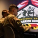 Army National Guard 2025 Best Warrior competitor takes notes during brief