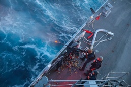 GM1 Don Dume fires the .50cal light machine-gun at an unmanned surface vessel