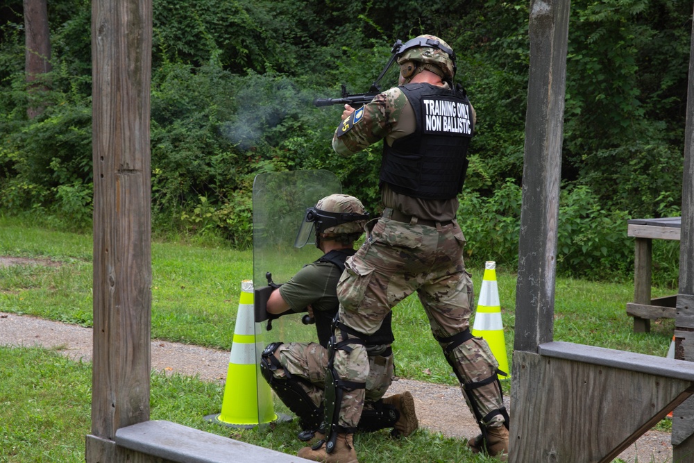 Sgt. Luke Entz fires an M500 shotgun - 2025 Best Warrior Competition