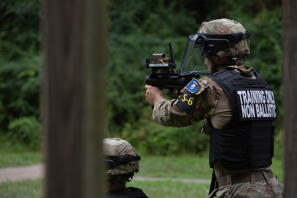 Spc. Canyon Blassingame fires an M320 grenade launcher - 2025 Best Warrior Competition