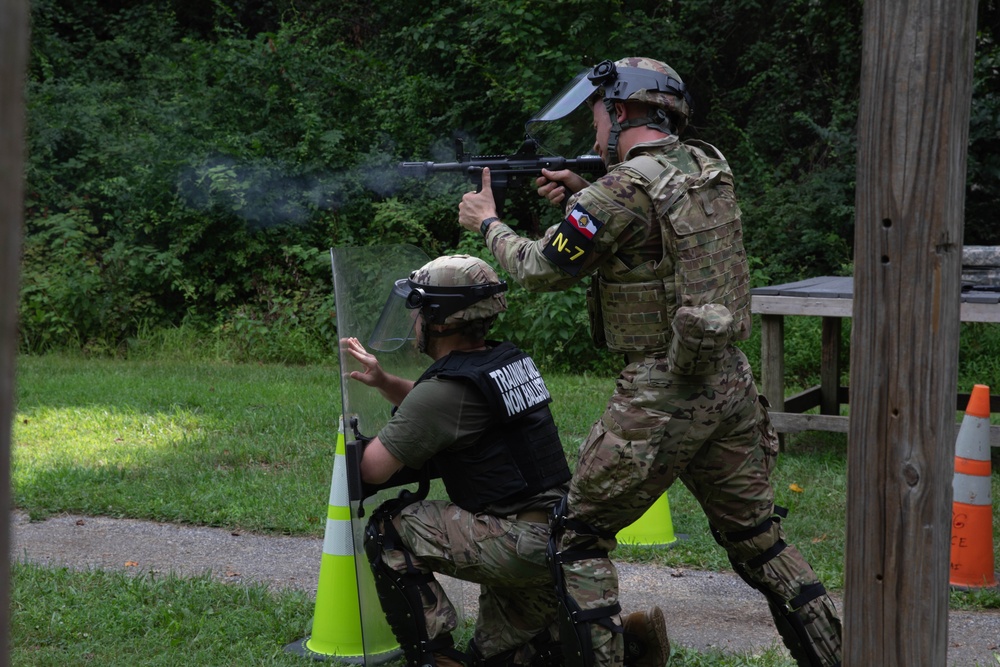 Sgt. Luke Cloward fires an M500 shotgun - 2025 Best Warrior Competition