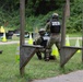 Sgt. Michael Fouts fires an M320 grenade launcher - 2025 Best Warrior Competition