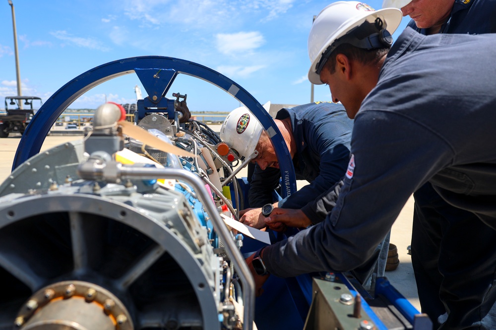 GSMC Gary Lusk and BMC Joshua Pelletier identify and label corresponding parts on an Allison gas turbine generator