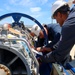 GSMC Gary Lusk and BMC Joshua Pelletier identify and label corresponding parts on an Allison gas turbine generator