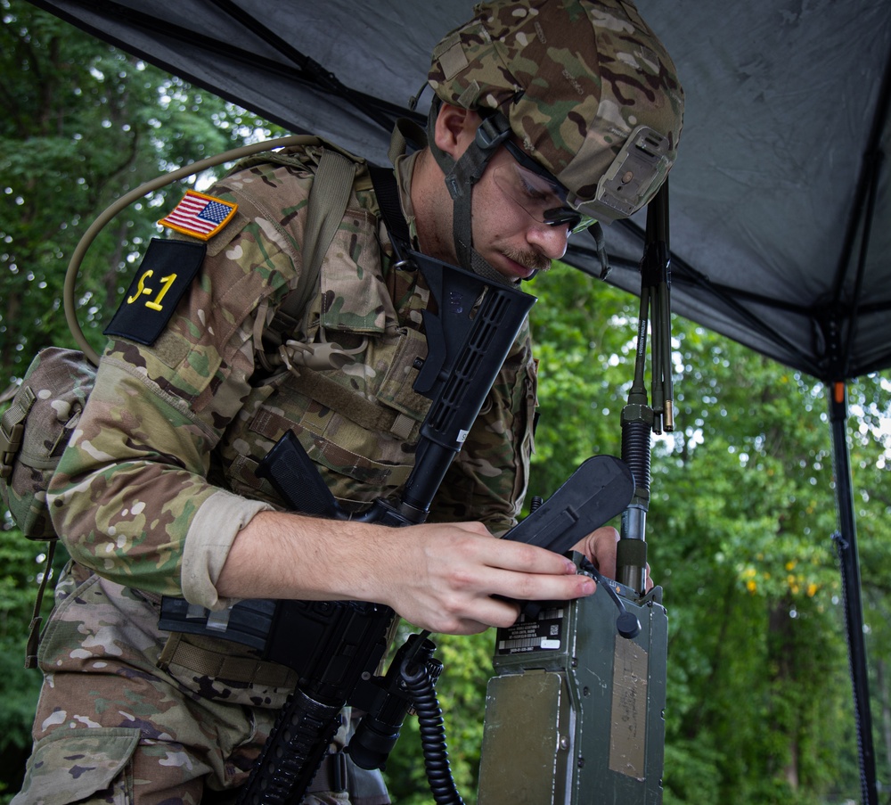 U.S. Army Spc. Adam Andrews assembles a radio during Best Warriror 2025