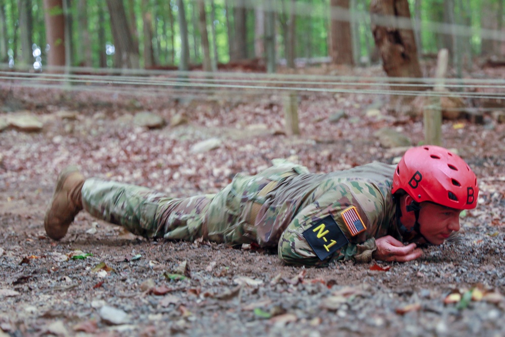 Sgt. Kristopher Piwowarczyk crawls in the obstacle Course - 2025 National Best Warrior