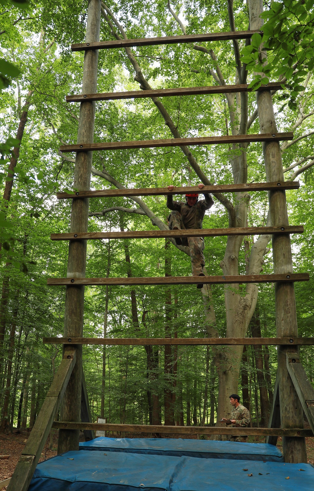 A competitor climbs a tower ladder in a obstacle course - 2025 National Best Warrior