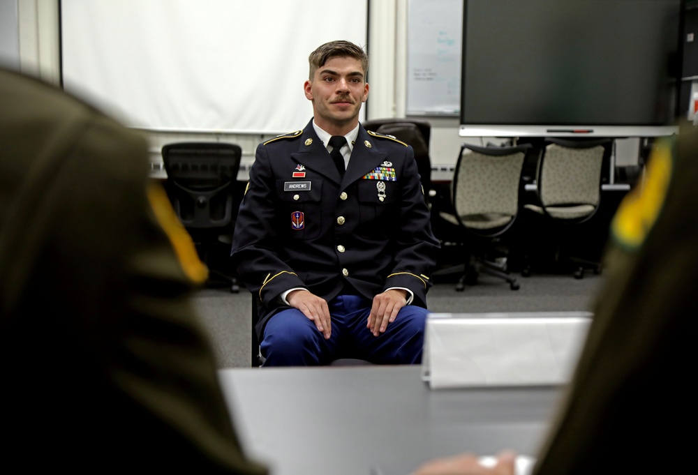 Competitors in the National Guard's 2025 National Best Warrior Competition appear before the board