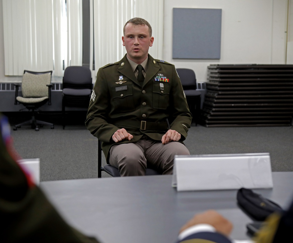 Competitors in the National Guard's 2025 National Best Warrior Competition appear before the board