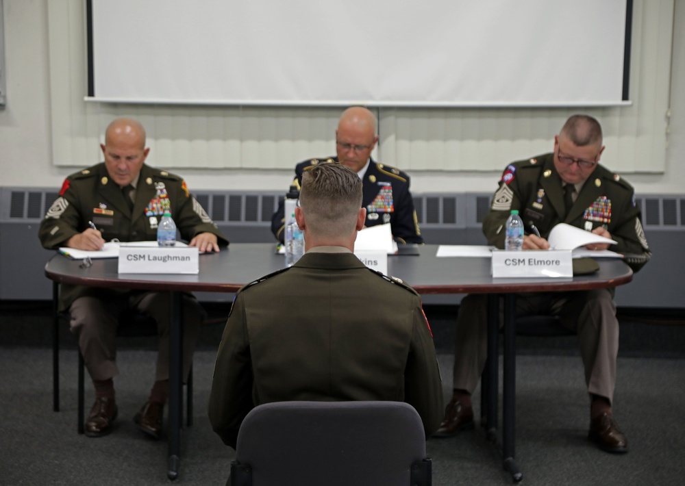 Competitors in the National Guard's 2025 National Best Warrior Competition appear before the board