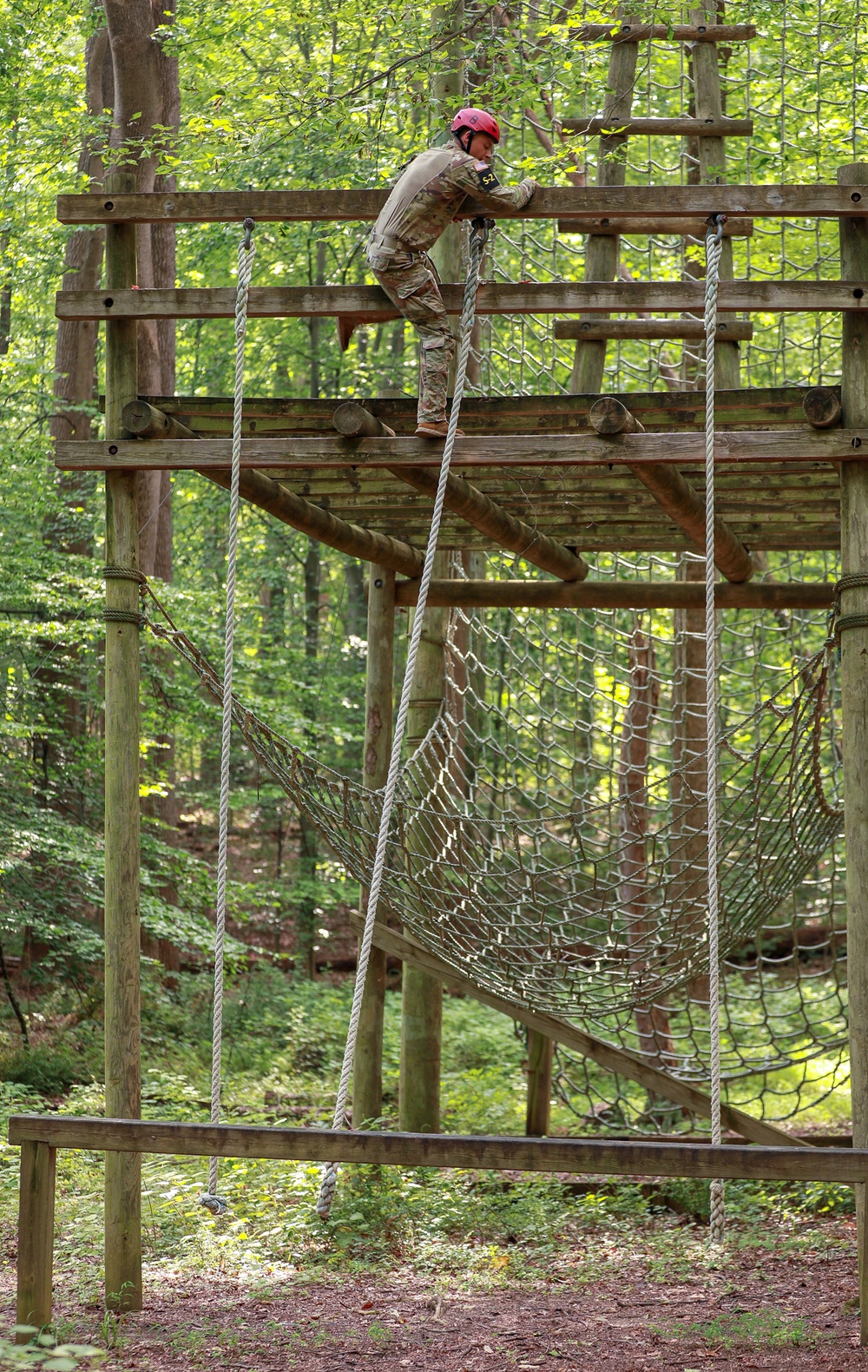 Sgt. Robert Ruiz-Rhoades climbs onto a platform in an obstacle course - 2025 National Best Warrior