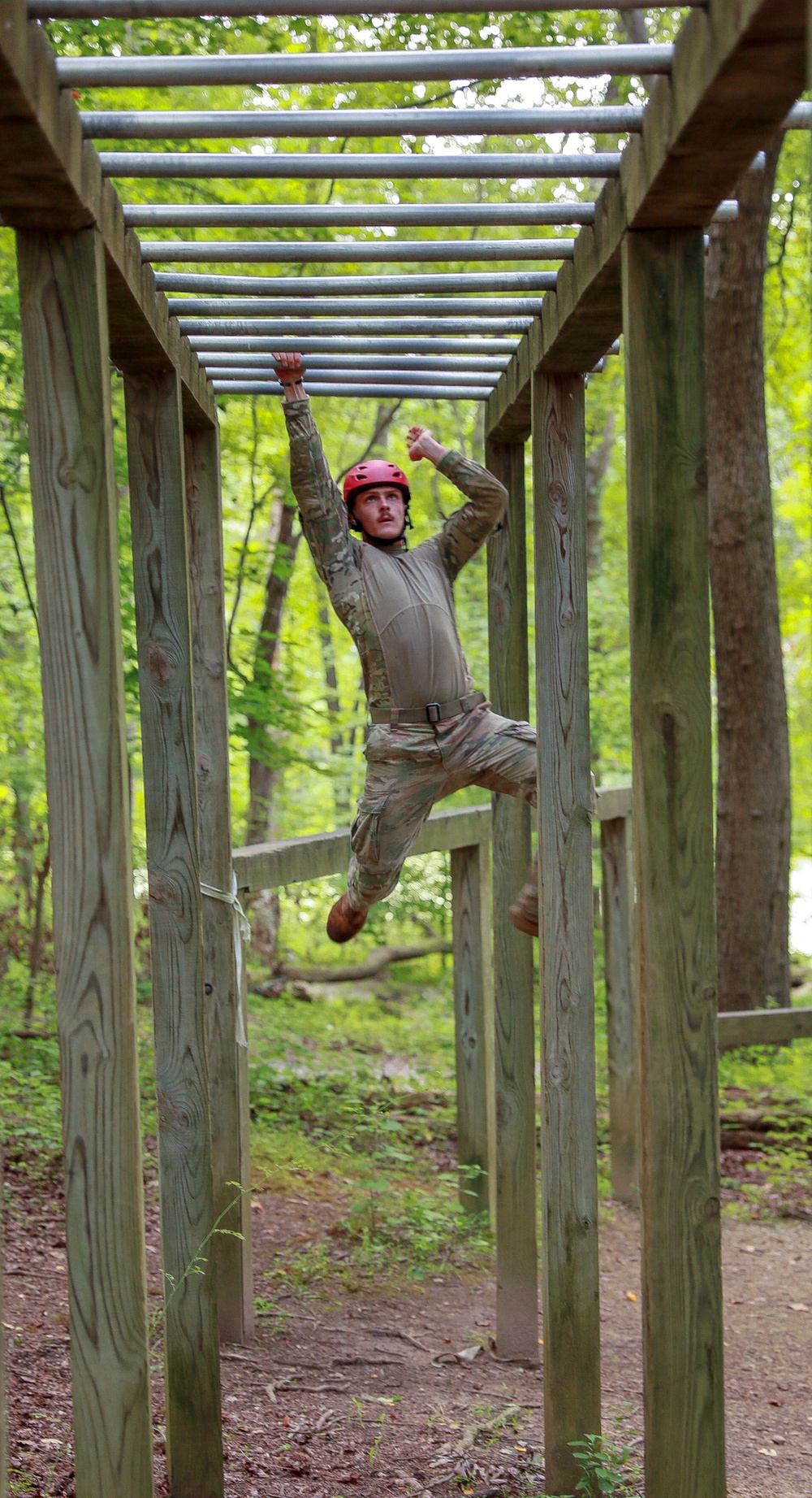 Sgt. Matthew Lee swings from bars in an obstacle course - 2025 National Best Warrior