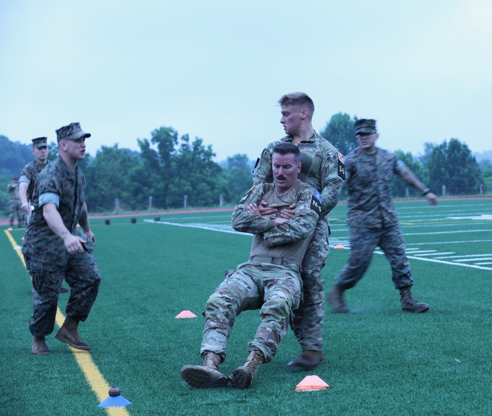 Spc. Jaden Hughes and Sgt. Matthew Lee participates in the Marine Combat Fitness test-2025 National Best Warrior
