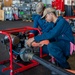 USS Essex Damage Controlman conduct P100 pump maintenance.