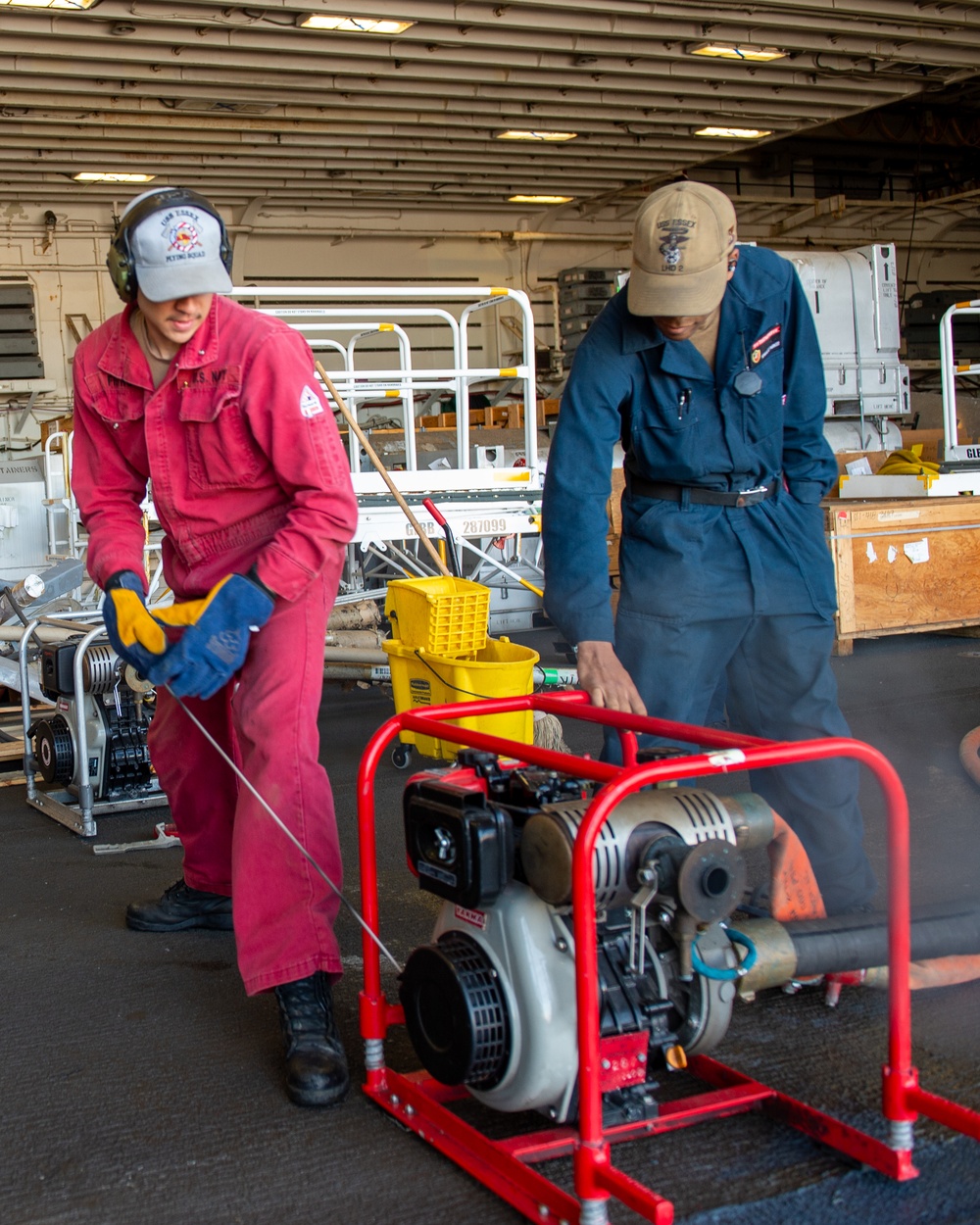 USS Essex Damage Controlman conduct P100 pump maintenance.