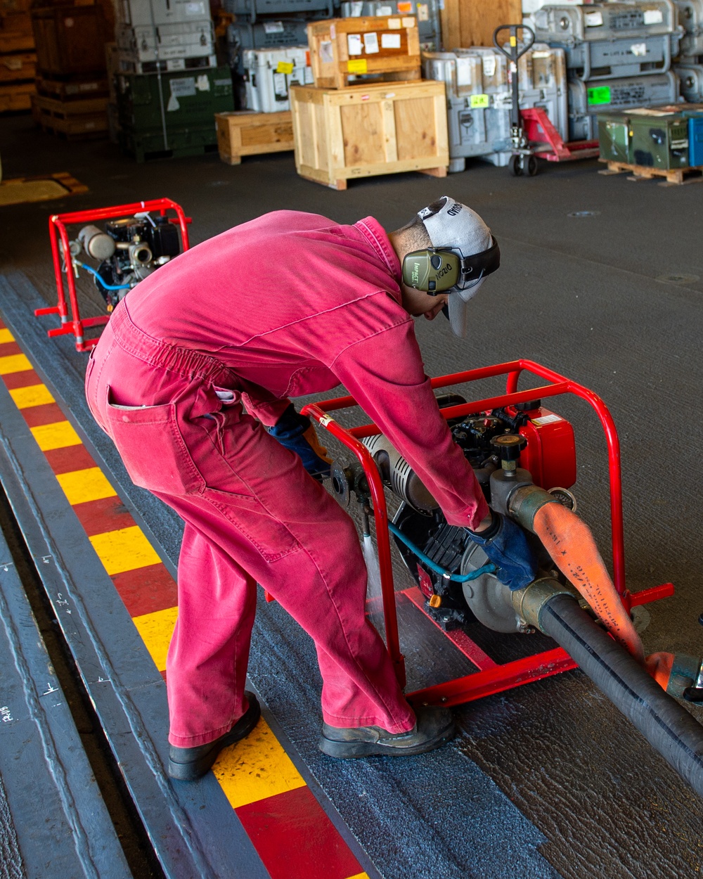 USS Essex Damage Controlman conduct P100 pump maintenance.
