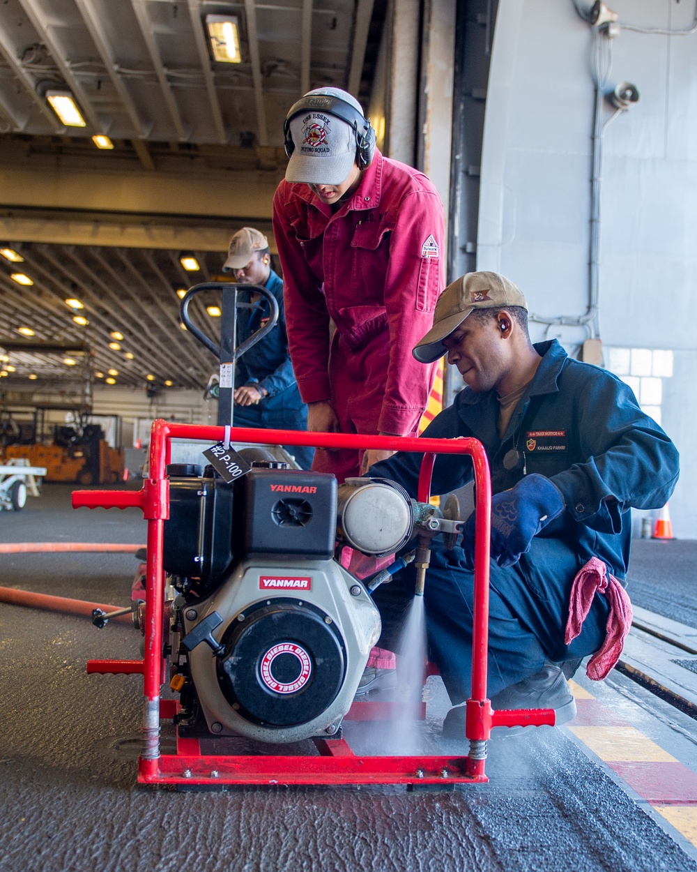 USS Essex Damage Controlman conduct P100 pump maintenance.