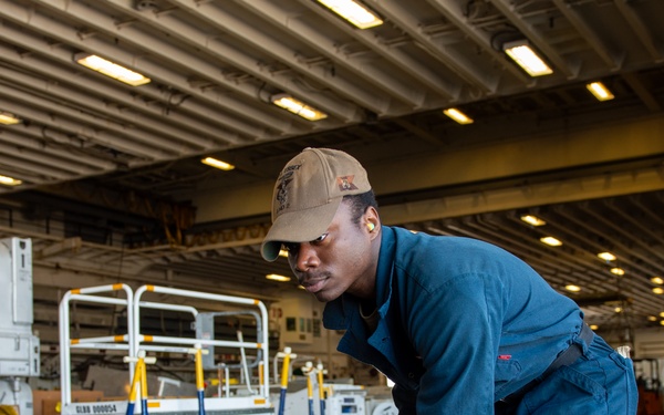USS Essex Damage Controlman conduct P100 pump maintenance.