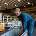 USS Essex Damage Controlman conduct P100 pump maintenance.