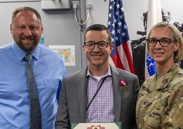 USAFMCOM awards Dunn's meritorious service