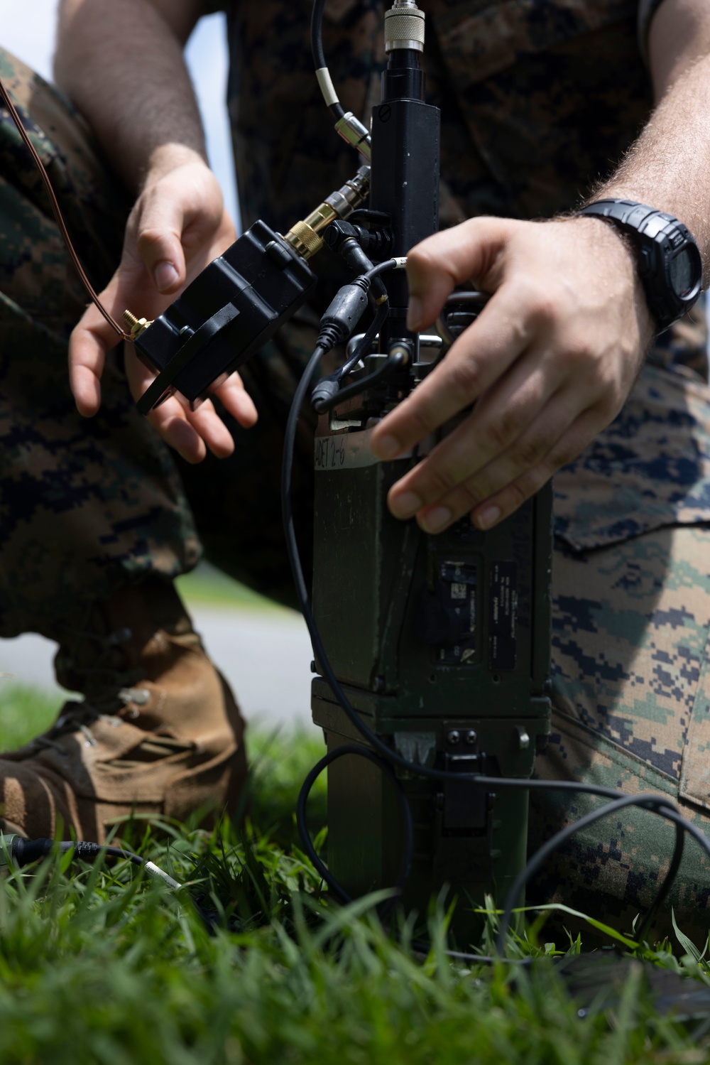 5th Air Naval Gunfire Liaison Company Marines craft expedient antennas with household goods