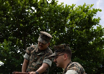 5th Air Naval Gunfire Liaison Company Marines craft expedient antennas with household goods