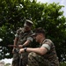 5th Air Naval Gunfire Liaison Company Marines craft expedient antennas with household goods