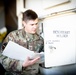 Staff Sgt. Nicholas Wolfe Inspects a desiccant holder at Edwards Air Force Base