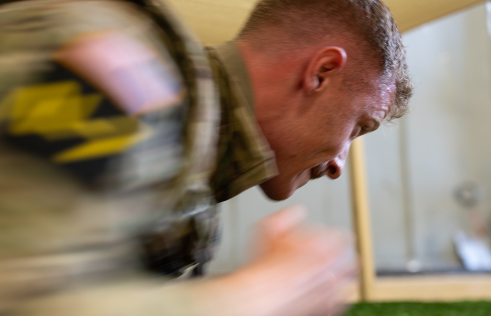 Sgt. Luke Cloward runs through indoor obstacle course-2025 National Best Warrior