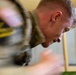 Sgt. Luke Cloward runs through indoor obstacle course-2025 National Best Warrior