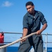USS PEARL HARBOR (LSD 52) Deck Department Sailors stow lines