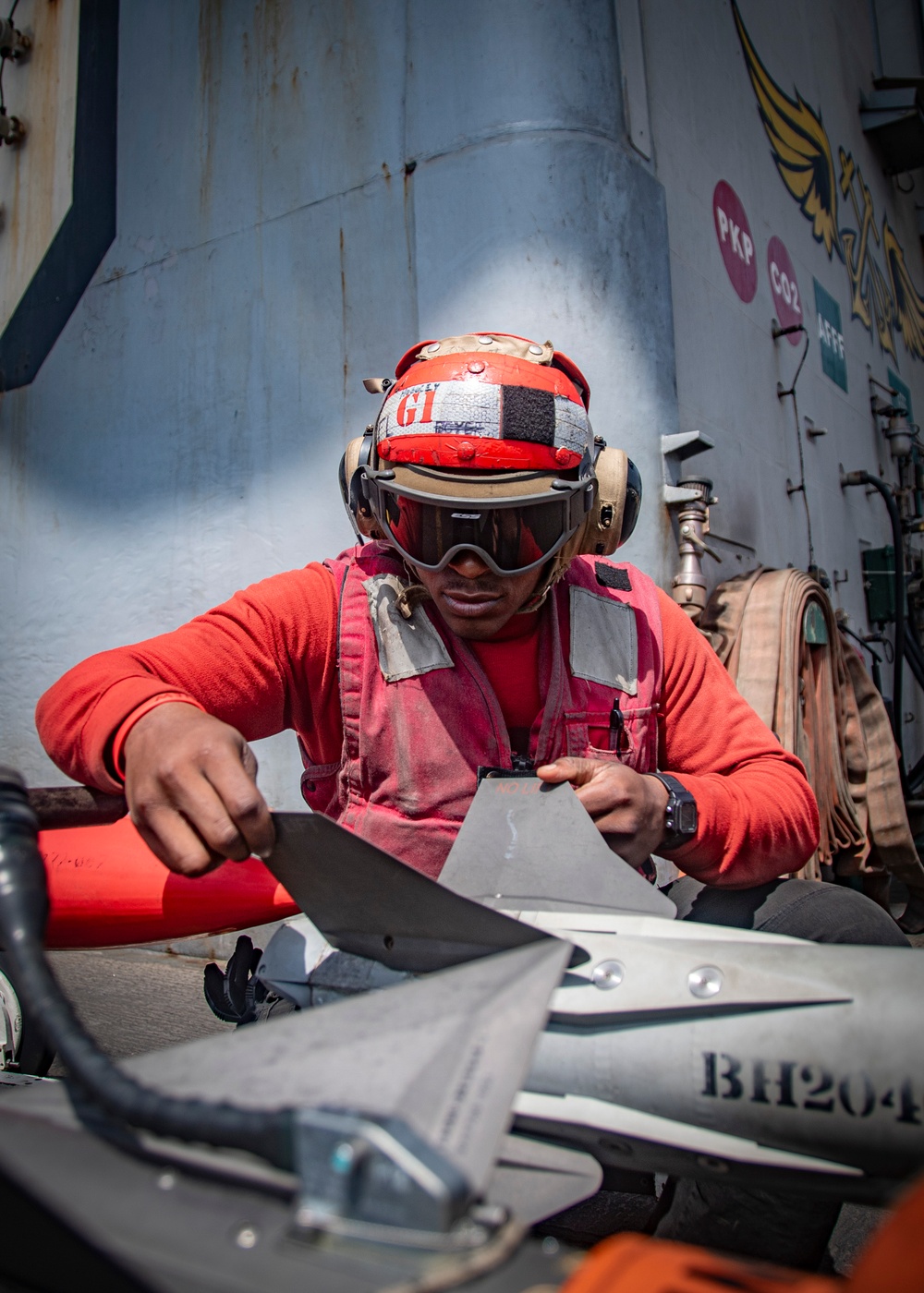 Nimitz Sailor Inspects Ordnance