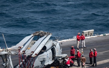 Nimitz Sailors Conduct Maintenance on Aircraft