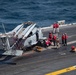 Nimitz Sailors Conduct Maintenance on Aircraft