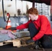 Nimitz Sailor Ties Down Equipment