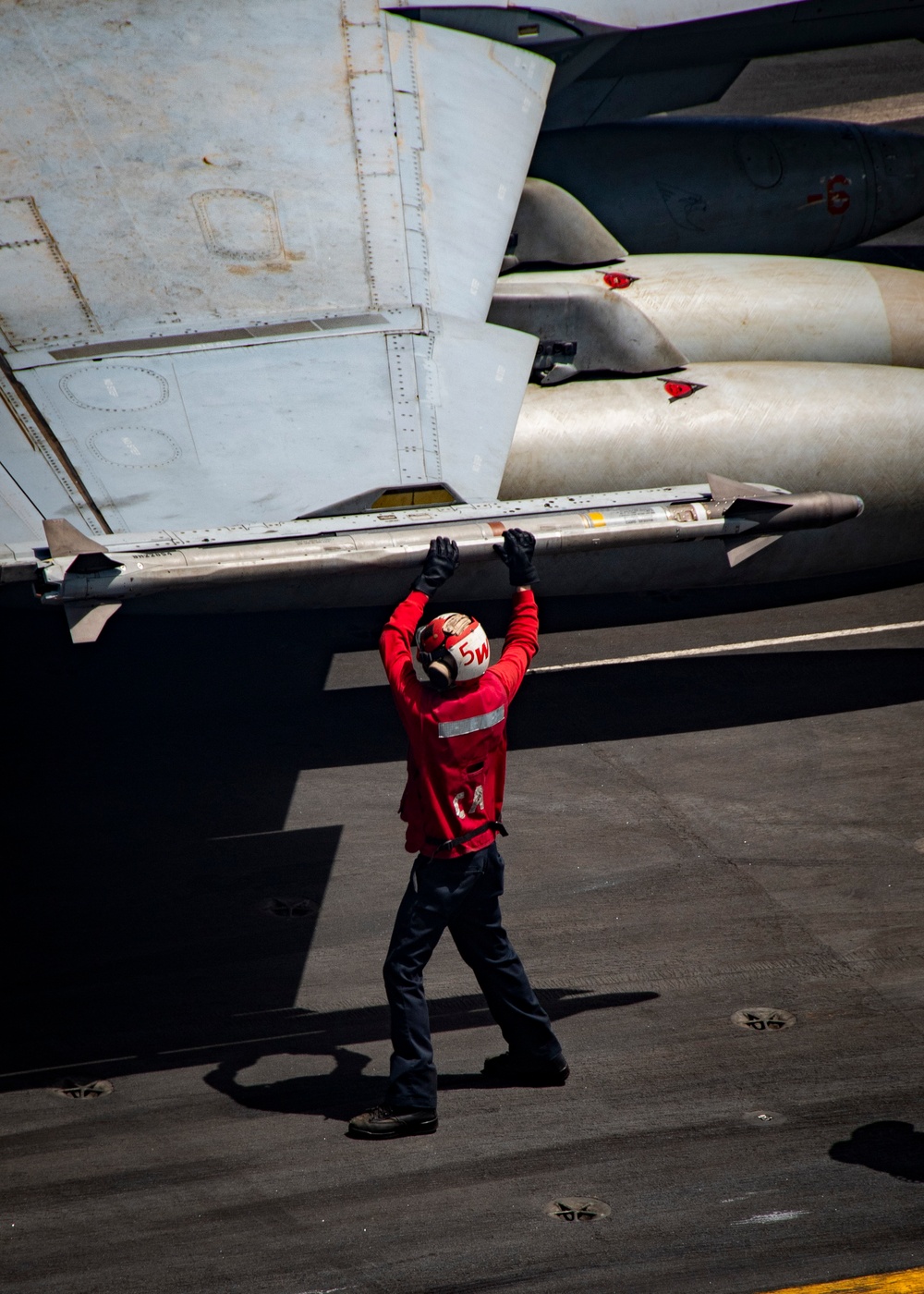Nimitz Sailor Inspects Ordnance