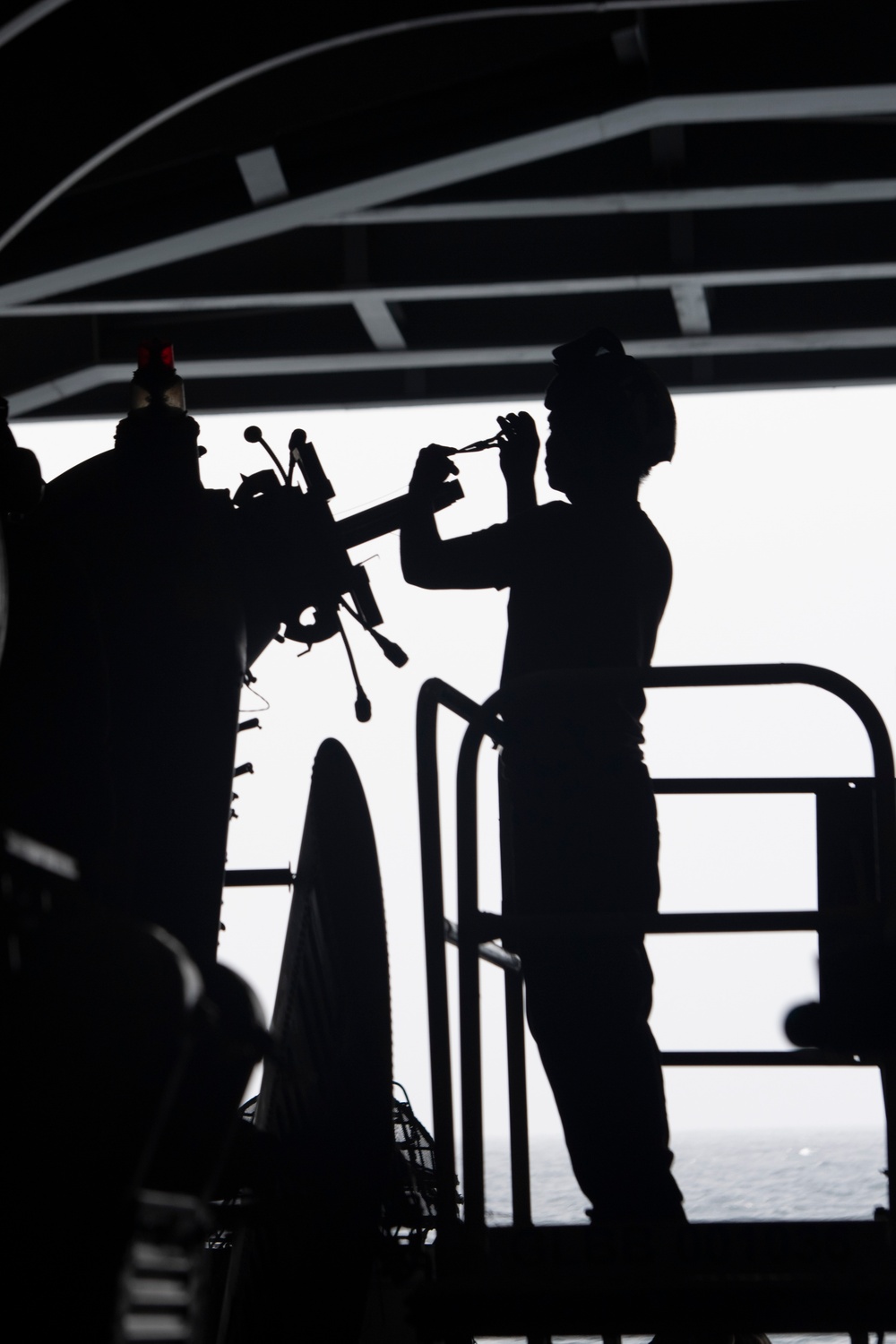 Nimitz Sailor Conducts Routine Maintenance on Aircraft
