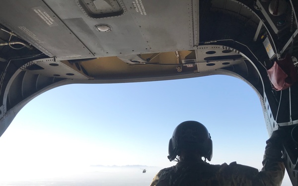 Chinook in flight supporting a base infrastructure project