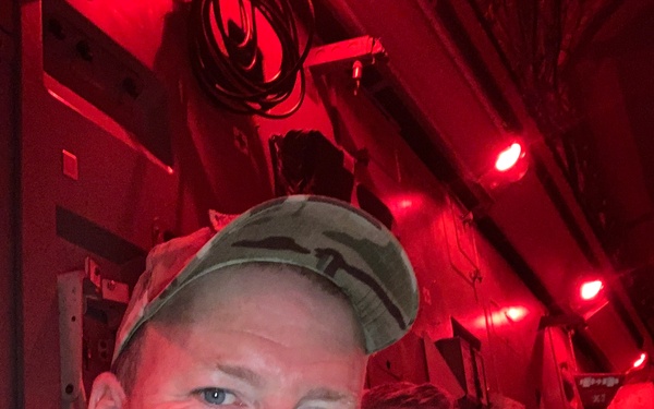 Ryan Williams, a civilian contracting officer technical representative with USACE, sits in the final departing aircraft from FOB Dwyer