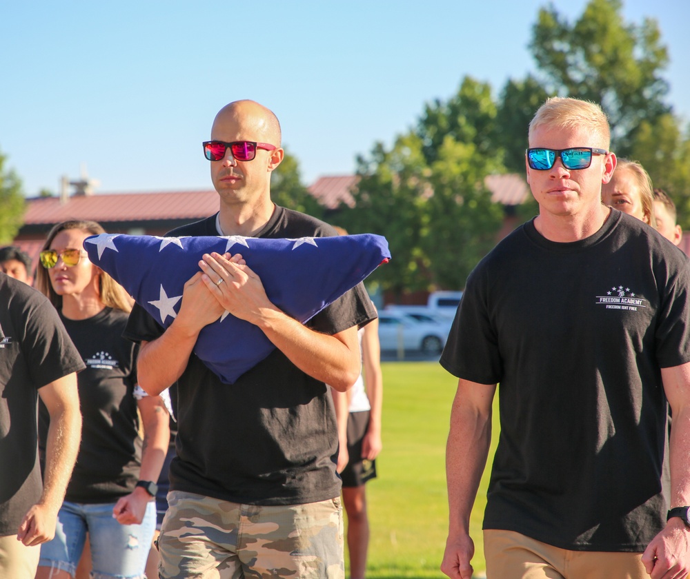 Freedom Academy Counselors conduct a flag raising ceremony
