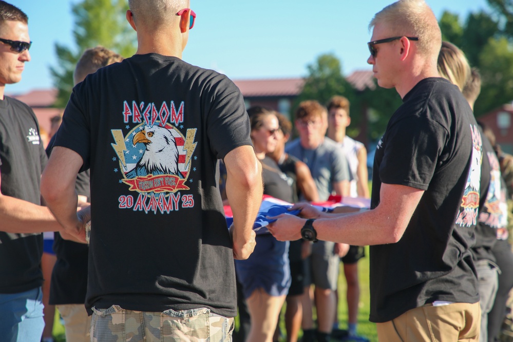 Freedom Academy Counselors conduct a flag raising ceremony