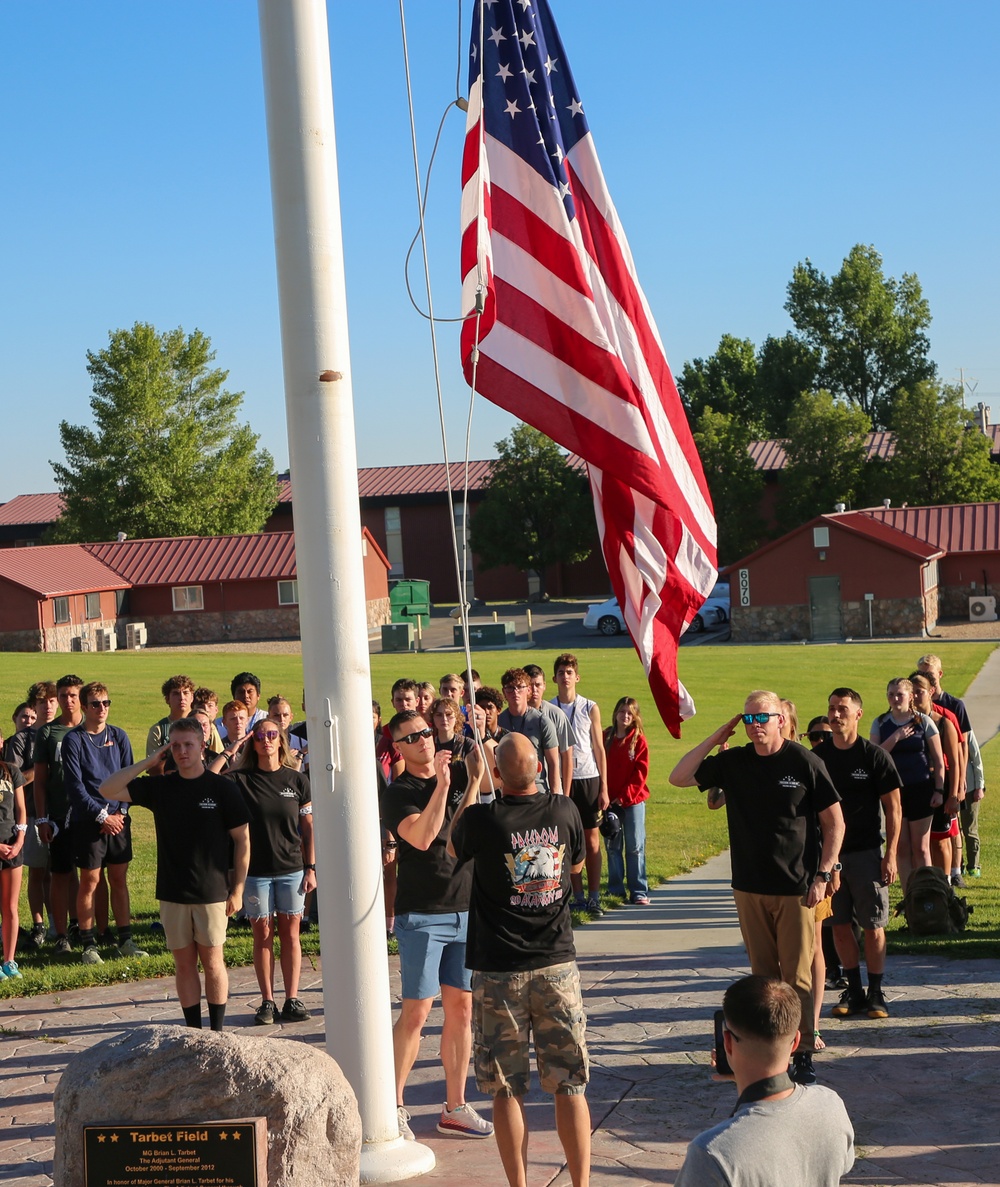 Freedom Academy Counselors conduct a flag raising ceremony