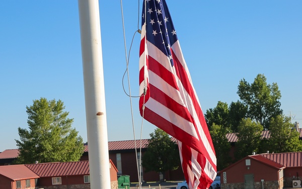 Freedom Academy Counselors conduct a flag raising ceremony