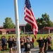 Freedom Academy Counselors conduct a flag raising ceremony