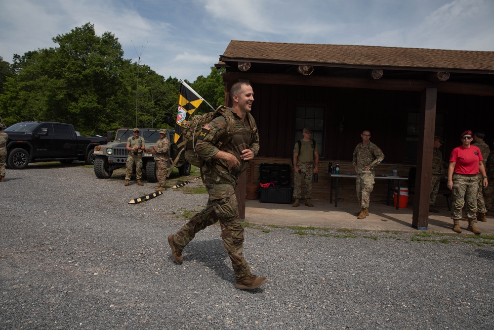 Staff Sgt. Brandon M. Byrne completes a ruck march - 2025 National Best Warrior