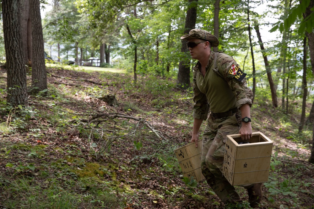 Staff Sgt. Miles Crawford carries ammo cans - 2025 National Best Warrior