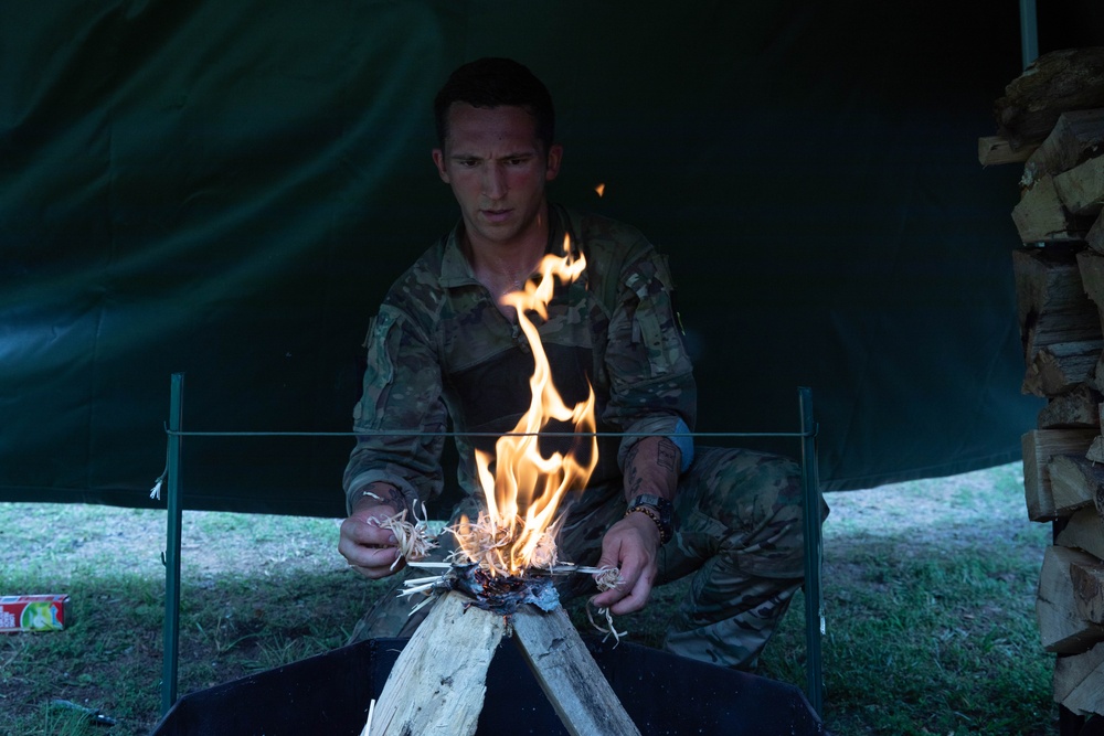 Sgt. Michael Fouts builds a fire - 2025 National Best Warrior