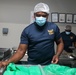 Sailors aboard the USS John Finn volunteer at Willing Hearts in Changi, Singapore